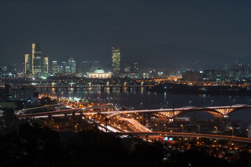 Fototapeta na wymiar Aerial view of traffic line at seoul city, night view, South Korea. 여의도가 보이는 서울의 야경. 
