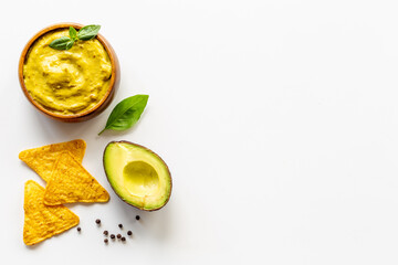 Guacamole avocado dip with mexican nachos chips