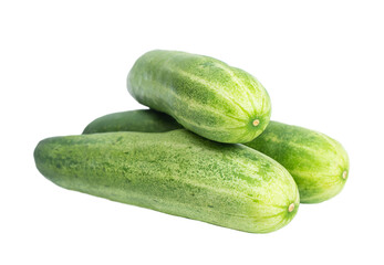Three fresh green cucumbers isolated