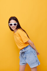 optimistic young woman hand gesture emotions summer style yellow background