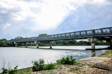 Fototapeta na wymiar bridge over river in the forest