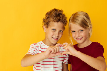 two joyful children casual wear games fun together isolated background