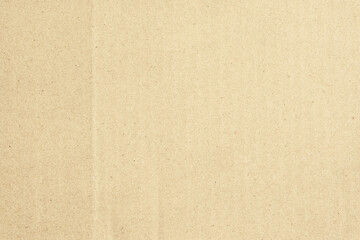 Fototapeta premium Brown cardboard background. The old paper for recycling. Carton texture. Art and craft concept. Grainy paperboard. Paper Box packaging surface. Simple and minimal backdrop.