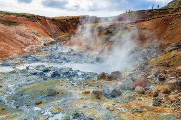 In Iceland, Hveragerdi is a geothermal field in the Krafla caldera area full of steam openings,...