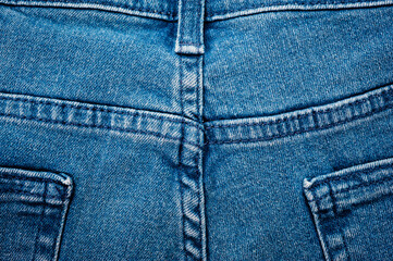 Close up of blue denim texture with sewing.