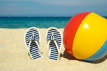 Family slippers on the sand on the beach