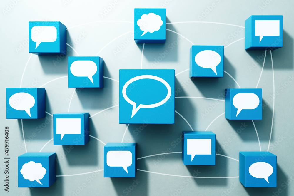 Aufkleber online communication and discussion concept. top view of many wood cubes with bubble icons.