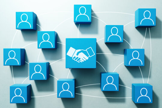 Business deal and collaboration on internet. Top view of many wood cubes with people icons.