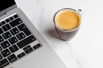 Distand work. Working with coffee cup with espresso in morning on white marble background. Aroma,...