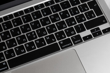 Keyboard of laptop close up. Russian and english keyboard