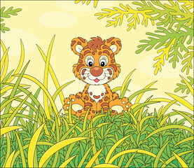 Obraz na płótnie Canvas Friendly smiling cute baby tiger sitting on green grass of a pretty forest glade on a beautiful sunny day, vector cartoon illustration