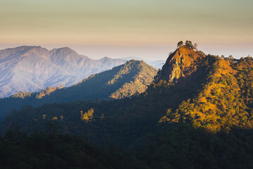 Fototapeta na wymiar Sunset over the mountain range with colorful sky and amazing landscape on Doi Langka Luang 2,031 metres (6,660 ft) at Khun Chae National Park locate in Amper. Wiangpapao , Chaingrai district Thailand.