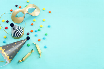 Party colorful image over blue background . Top view, flat lay