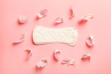 Obraz na płótnie Canvas Menstruation pad on pastel pink background, women critical days, gynecological concept, menstruation cycle