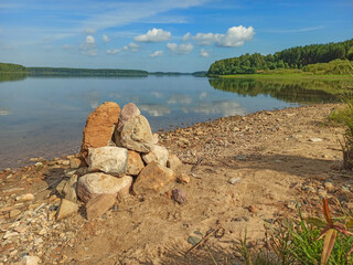 Golden autumn. The shore of the forest lake