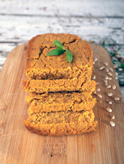 Plant based, meat free products. Vegan, vegetable pate, sliced on wooden board. Rustic composition on vintage boards.