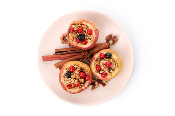 Plate with baked apples isolated on white background