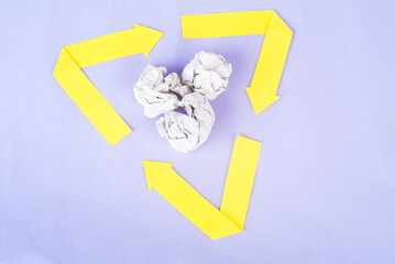 recycle mark with crumpled paper inside on very peri background. zero waste concept