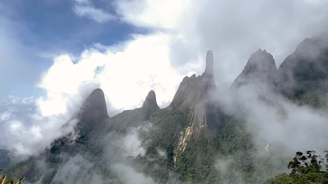 Slow motion panorama landscape view of mountain range Serra dos Orgaos in Teresopolis with cloud formation rolling in Rio de Janeiro Atlantic Brazilian rain forest