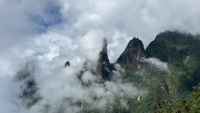 Time lapse of clouds forming around mountain range peaks of Serra dos Orgaos in Teresopolis part of Atlantic rain forest on coast of Rio de Janeiro in Brazil