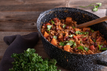 Stew pot with beans, meat, sweet potatoes and vegetable