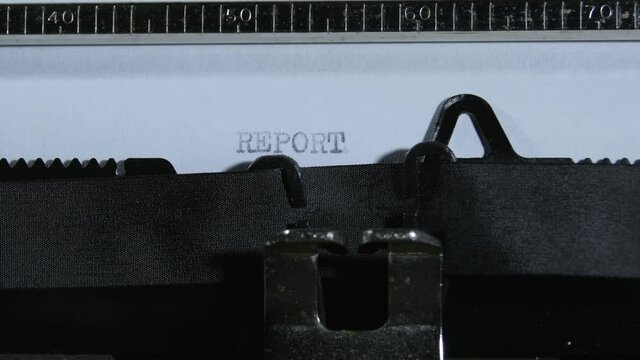 Typing REPORT with an old manual typewriter