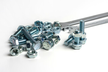 several open-end metal wrenches for working with bolts. Close-up on a white background. Silver...