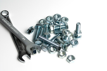 several open-end metal wrenches for working with bolts. Close-up on a white background. Silver...