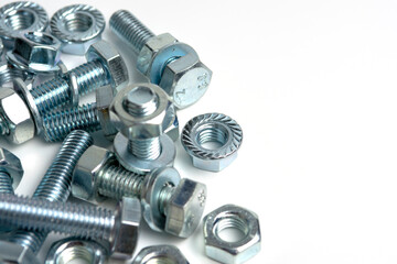 several bolts with nuts made of silver metal. Close-up isolated on a white background. Copy space