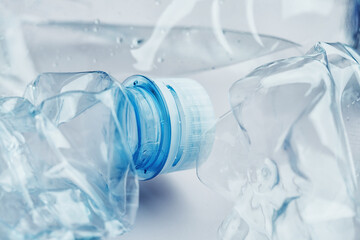 Crumpled empty water bottles texture background, recycling, reuse and world environment day concept