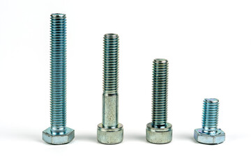Several bolts made of silver metal. Close-up isolated on a white background.