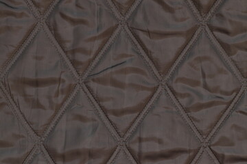 The texture of the fabric lining of a winter jacket. Fabric texture. 
