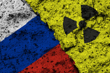 Concept of the Nuclear Energy Policy of Russia with a flag and a radiation hazard sign painted on a rough wall