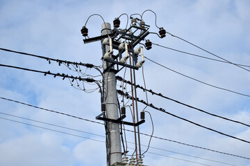 Electric pole with wires and insulators.