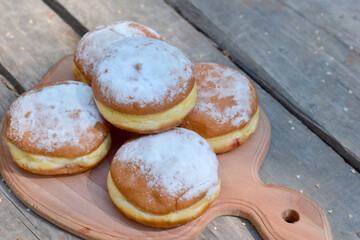 Butter buns with powdered sugar on the table.