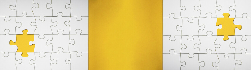 Fototapeta premium Empty white details of puzzle on yellow background banner panorama, with space for text