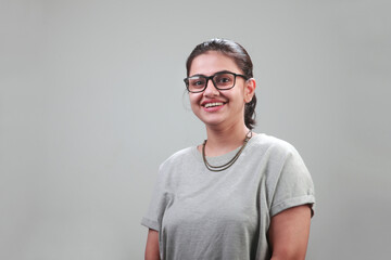 Portrait of a happy young woman with a smiling face 