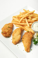 british traditional fish and chips meal on white plate