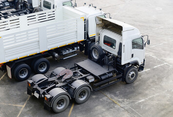 Heads of white semi trailer trucks