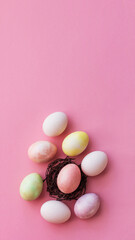 Easter eggs in pastel color on a light pink background, Light Easter, copy space, vertical format for stories