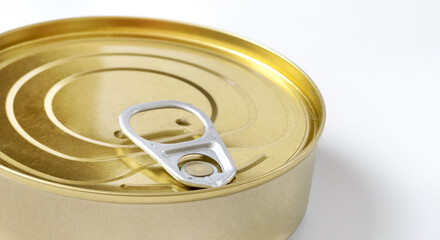 Close-up of a golden tin can with a built-in key.