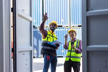 Professional foreman work at Container cargo site check up goods in container. Workers are opening containers for inspection and check.	