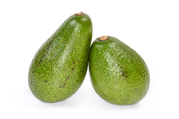 Two whole green avocado fruits on a white background