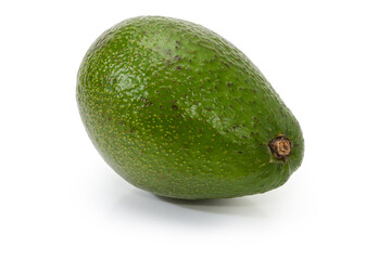 Whole green avocado fruit on a white background