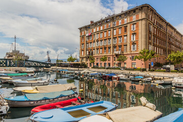 Fototapeta na wymiar Small boats at Mrtvi canal and old buildings in Rijeka, Croatia