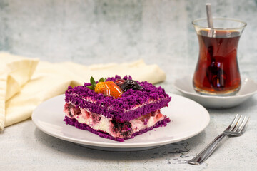 Portion fruit cake on stone background. Traditional Turkish cuisine delicacies. Close-up.