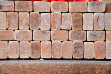 Fototapeta premium Close up of The brown bricks are laid out in a row for construction preparation in the building construction at Thailand.