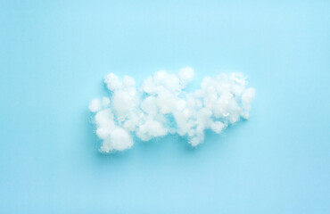 pile of filler, white siliconized hollowfiber, polyester fiber on light blue background with copy space