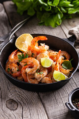 Delicious sea food, grilled shrimps with lemon