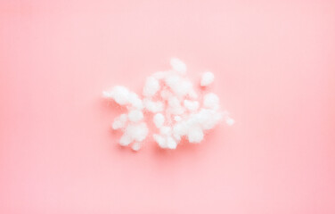 pile of filler, white siliconized hollowfiber, polyester fiber on light pink background
